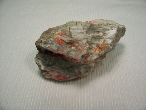 Ulexite with Realgar. U.S. Borax Mine, Boron, Kern County, California, USA.